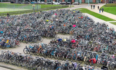 many bicycles parked, typical of holland