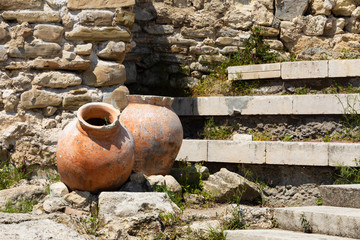 Fototapeta premium Ancient amphora in old town of Nesebar, Bulgaria. Ancient pottery pots. Two amphora 