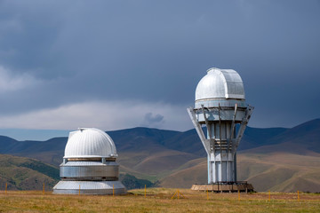 Observatory telescope on green valley among mountains mountains in day, great design for any...
