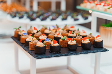 Tray of small beautiful appetizers at an event