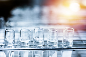 Double exposure test-tube in science background concept.