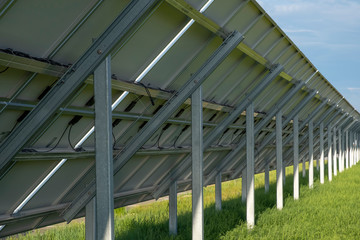 Obraz premium Back side of solar panels. Photovoltatic power industry.