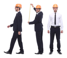 in full growth .a qualified architect in an orange helmet