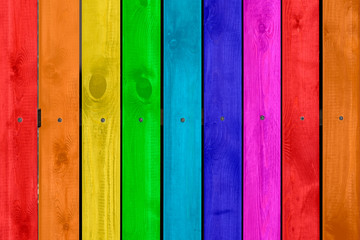 Rainbow colored wood background, copy space.