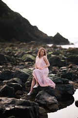 Girl on a sunset beach walks, sunset on the ocean. State of Oregon, Cannon Beach