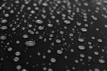 Water drops on a shiny surface, selective focus. Rain drops. Abstract background.