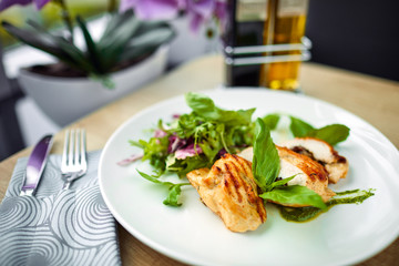 grilled chicken breast and salad