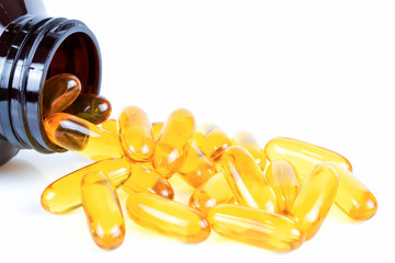 Fish oil capsules with omega 3 in bottle on white background. Copy space for your text, Health care...