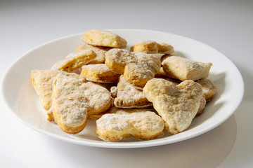 Concept business crisis, angry young businessman in horror clutching his head, in the background is a stock chart with a negative trend.