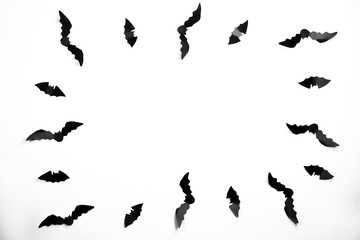 Halloween paper decorations concept. Black paper bats on a white background. Halloween concept.