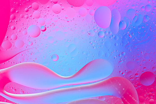 pink and blue background of smears and bubbles