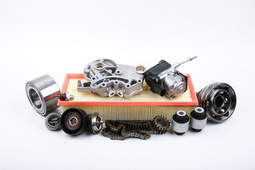 a bunch of new car parts on a white background