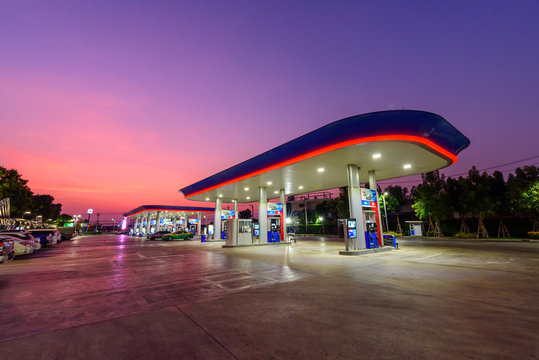 Samutsakhon, Thailand -  3  March,2020 :  PTT petrol station with a lot of car  in sunset time 