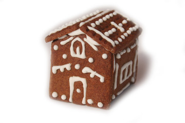 Homemade Christmas chocolate cookies in shape of little house isolated on white background