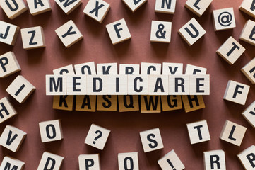 Medicare word concept on cubes