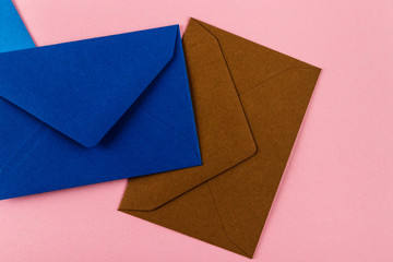 Colorful envelopes on a pink background.