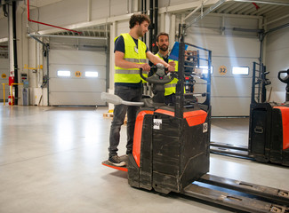 Training on a forklift, managers and workers  © Stock Rocket