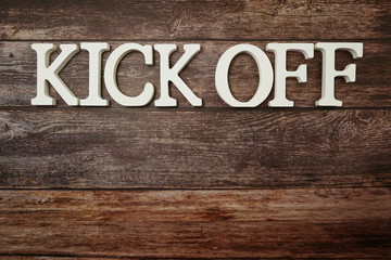 Fototapeta premium Kick Off alphabet letters on wooden background