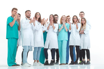 group of doctors and nurses applauding together