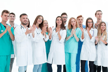 top view. a group of smiling doctors pointing at you.