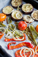 Tray with baked eggplant, tomatoes, onion and pepper