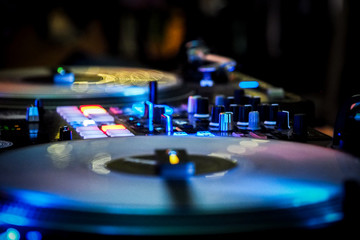 Fototapeta na wymiar DJ vinyl players in dark nightclub, party in the dance club, DJ equipment, defocused 