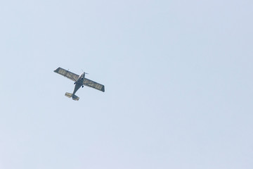 Ultralight plane flies over Pokhara and Annapurna region in Nepal. Copy space for advertising and design