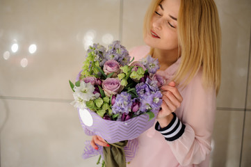 Floral bouquet from roses, tulips, and delphinium flowers.