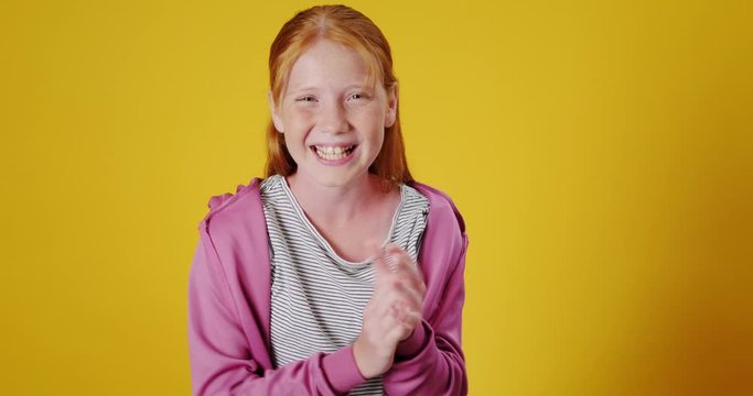 Slow Motion Portrait of Teenager Girl Clapping Smiling and Cheering