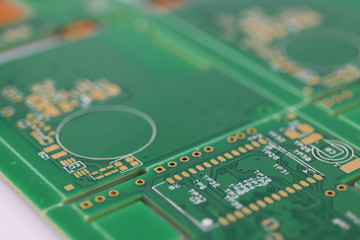 Multiplied printed circuit boards PCB isolated on the white background. PCB assembly. Close-up view