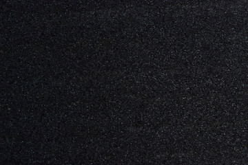 Dark black wall texture background.