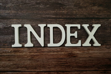 Index alphabet letter on wooden background