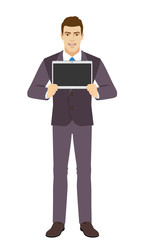 Smiling Businessman showing blank digital tablet PC. Full length portrait of Businessman in a flat style.