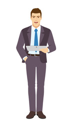 Smiling Businessman holding digital tablet PC. Full length portrait of Businessman in a flat style.