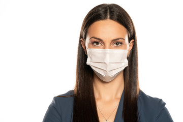 Beautiful young woman with protective mask on her face