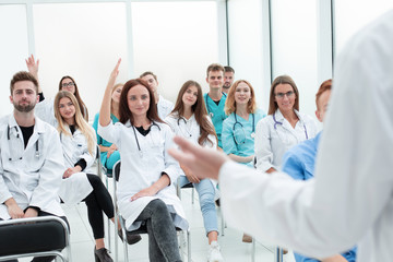 close up. the teacher answering the questions of medical students.