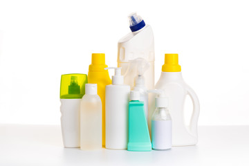 Cleaning product plastic multi-colored container for house clean on white table and isolated. household chemicals