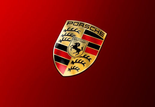 Porsche Logo On A Red Car