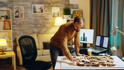 Architect working at night in his home office