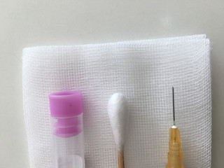 Naklejka premium blood collection tube and syringe and swab with gauze in healthcare check uo concept