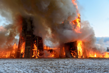 Fototapeta na wymiar Building in inferno of flames