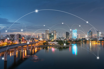 Obraz premium Smart city and wireless communication network concept. Digital network connection lines of Hanoi at Hoang Cau lake