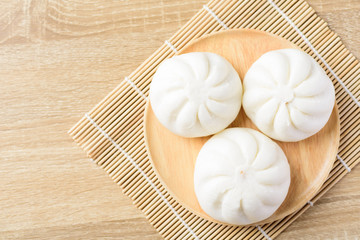 Steamed buns on wooden plate ready to eating, Asian food, Top view