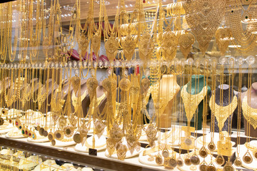 Gold necklaces and bracelets designed in various ways in front of the store.