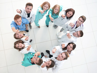 Fototapeta na wymiar background image of the head and a group of young doctors