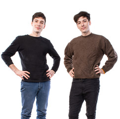 Two handsome young men posing on a white background