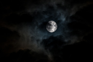 Naklejka na ściany i meble Moon in dark clouds