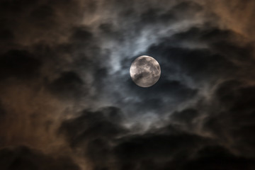 Obraz na płótnie Canvas Moon in dark clouds