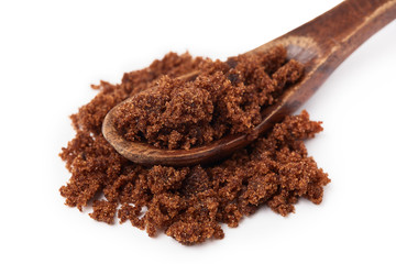 Dark muscovado sugar, also called Barbados sugar, khandsari, or khand, isolated on white background