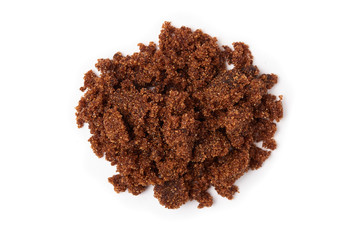 Dark muscovado sugar, also called Barbados sugar, khandsari, or khand, isolated on white background